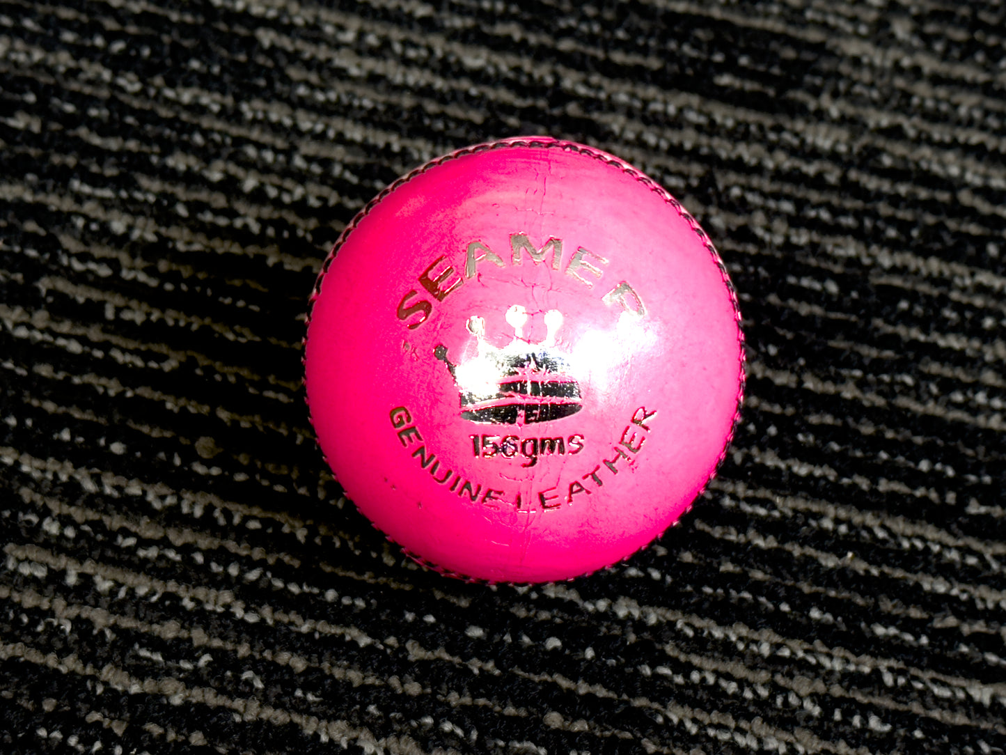 Pack of 6 pink Black Ash Seamer cricket leather balls, premium quality, 156 grams each, suitable for practice and T20 cricket, featuring 4-piece construction and excellent shape retention, machine stitched according to MCC regulations.