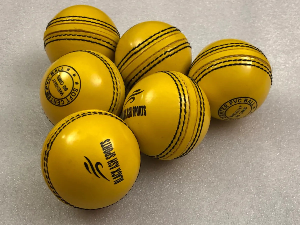 Pack of 6 yellow Black Ash PVC soft cricket training balls, each weighing 90 grams, crafted from top-quality PVC with a soft center for enhanced playability. Ideal for coaching and training, these balls are suitable for both indoor and outdoor cricket activities.