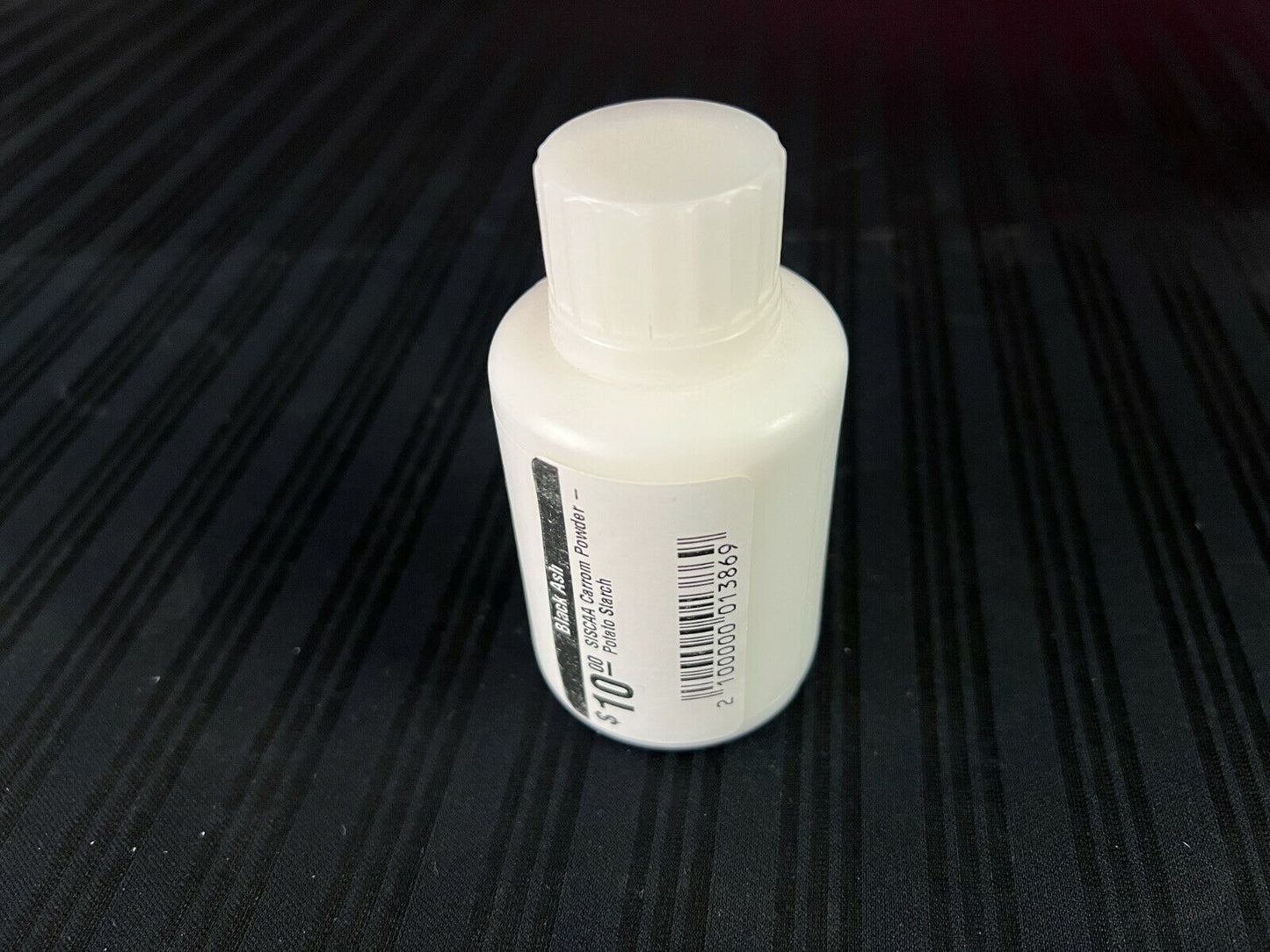 Specialized SISCAA potato starch carrom powder for smooth sliding, in a pack of three bottles, used by professional players, available through Black Ash Sports.
