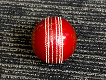 Load image into Gallery viewer, Pack of 6 red cricket balls, &#39;Black Ash Cavalier&#39; series, made from premium quality, genuine Australian alum-tanned leather with 4-piece construction. These waterproof, machine-stitched balls offer excellent shape retention, are suitable for 50 overs, comply with MCC regulations, and weigh 156 grams (5.5 ounces) each.