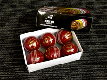 Load image into Gallery viewer, Pack of 6 red cricket balls, &#39;Black Ash Cavalier&#39; series, made from premium quality, genuine Australian alum-tanned leather with 4-piece construction. These waterproof, machine-stitched balls offer excellent shape retention, are suitable for 50 overs, comply with MCC regulations, and weigh 156 grams (5.5 ounces) each.