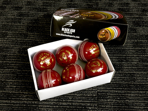 Pack of 6 red cricket balls, 'Black Ash Cavalier' series, made from premium quality, genuine Australian alum-tanned leather with 4-piece construction. These waterproof, machine-stitched balls offer excellent shape retention, are suitable for 50 overs, comply with MCC regulations, and weigh 156 grams (5.5 ounces) each.