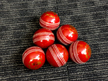 Load image into Gallery viewer, Pack of 6 red cricket balls from Black Ash Premium grade, featuring genuine leather with a 4-piece construction for excellent shape retention. These premium quality, machine-stitched balls are designed for 30 to 35 overs, meet MCC regulations, and each ball weighs 156 grams (5.5 oz).