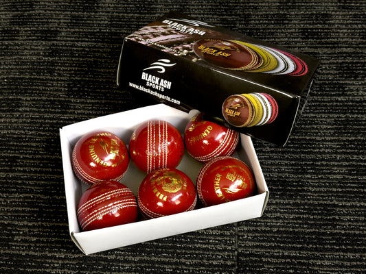 Pack of 6 red cricket balls from Black Ash Premium grade, featuring genuine leather with a 4-piece construction for excellent shape retention. These premium quality, machine-stitched balls are designed for 30 to 35 overs, meet MCC regulations, and each ball weighs 156 grams (5.5 oz).