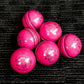 Pack of 6 pink cricket balls named 'Black Ash Cavalier,' crafted from premium quality, genuine Australian alum-tanned leather with a 4-piece construction for superior shape retention. These waterproof balls are suitable for 50 overs, conform to MCC regulations, machine-stitched, and each weighs 156 grams (5.5 ounces).