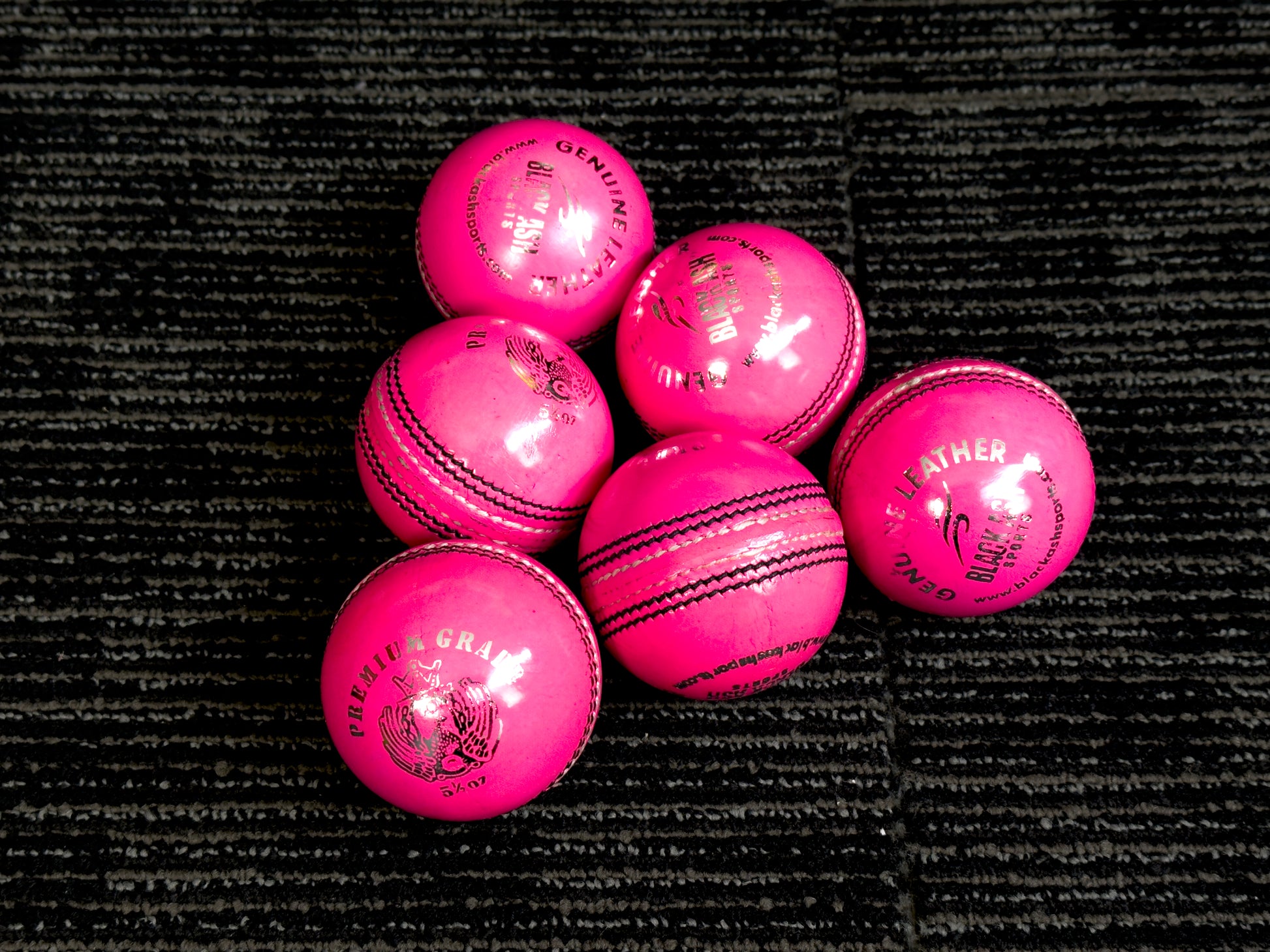 Black Ash Premium grade pack of 6 pink cricket leather balls, each 156 grams, made of genuine leather with 4-piece construction, excellent shape retention, suitable for 30 to 35 overs, and meeting MCC regulations.