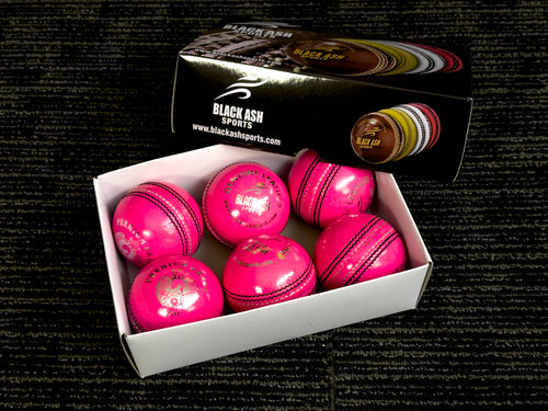 Black Ash Premium grade pack of 6 pink cricket leather balls, each 156 grams, made of genuine leather with 4-piece construction, excellent shape retention, suitable for 30 to 35 overs, and meeting MCC regulations.