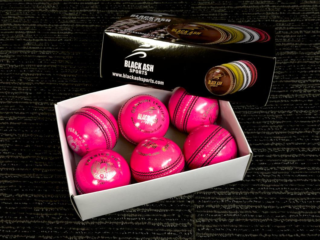 Black Ash Premium grade pack of 6 pink cricket leather balls, each 156 grams, made of genuine leather with 4-piece construction, excellent shape retention, suitable for 30 to 35 overs, and meeting MCC regulations.