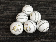 Load image into Gallery viewer, Pack of 6 white cricket balls from Black Ash Premium grade, made of genuine leather with 4-piece construction for excellent shape retention. These premium quality balls are machine-stitched, adhere to MCC regulations, and are ideal for 30 to 35 overs, each weighing 156 grams (5.5 ounces).