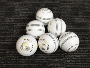 Pack of 6 white cricket balls from Black Ash Premium grade, made of genuine leather with 4-piece construction for excellent shape retention. These premium quality balls are machine-stitched, adhere to MCC regulations, and are ideal for 30 to 35 overs, each weighing 156 grams (5.5 ounces).