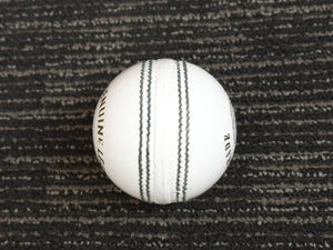 Pack of 6 white cricket balls from Black Ash Premium grade, made of genuine leather with 4-piece construction for excellent shape retention. These premium quality balls are machine-stitched, adhere to MCC regulations, and are ideal for 30 to 35 overs, each weighing 156 grams (5.5 ounces).