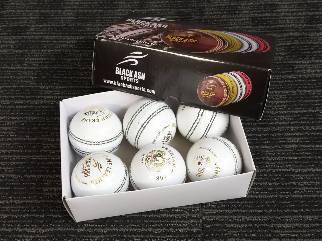 Pack of 6 white cricket balls from Black Ash Premium grade, made of genuine leather with 4-piece construction for excellent shape retention. These premium quality balls are machine-stitched, adhere to MCC regulations, and are ideal for 30 to 35 overs, each weighing 156 grams (5.5 ounces).