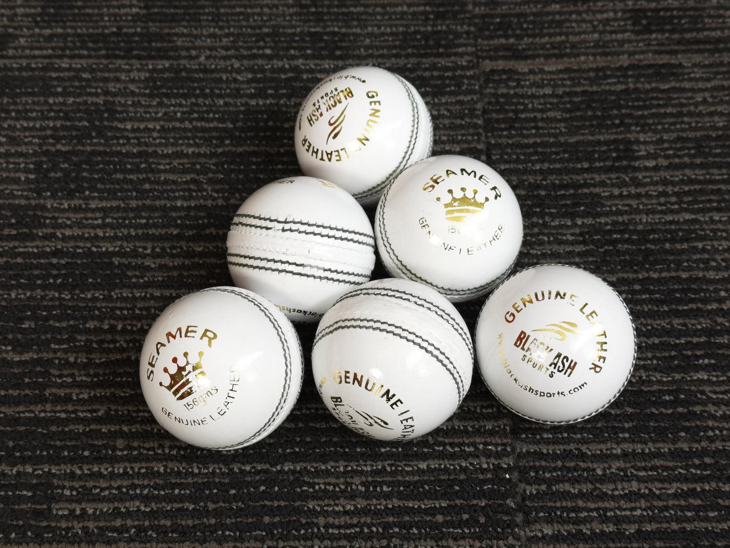 Pack of 6 white Black Ash Royal Crown cricket leather balls, 156 grams, designed for practice T20 cricket, with premium quality genuine leather, 4-piece construction, and meeting MCC standards