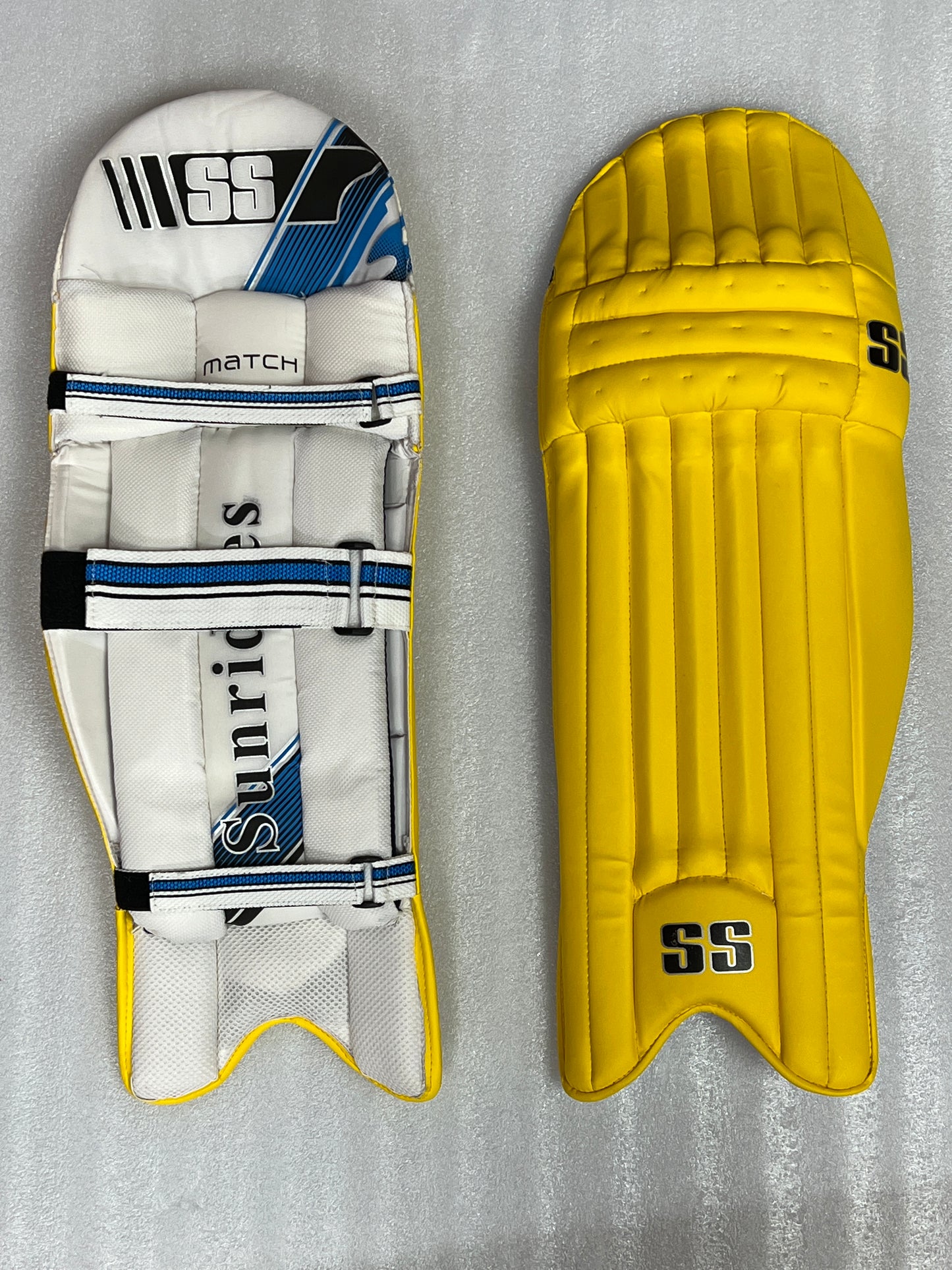 SS Match Cricket Batting Pads, lightweight with a new design for enhanced comfort, made from fine materials with cane inserts, extra-wide side bolsters, knee protection zone, and mesh lining for cooling and ventilation, offering top protection.
