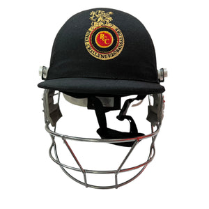 Black Ash custom IPL adjustable helmet, adorned with the logos of IPL teams like Kolkata Knight Riders and Mumbai Indians, featuring a high impact polypropylene shell, chrome finish steel grill with 8 micro adjustments, sweat-absorbent padding, adjustable to fit 52-58 cm, with nape dial adjuster and soft ear protection for optimal fit and protection.