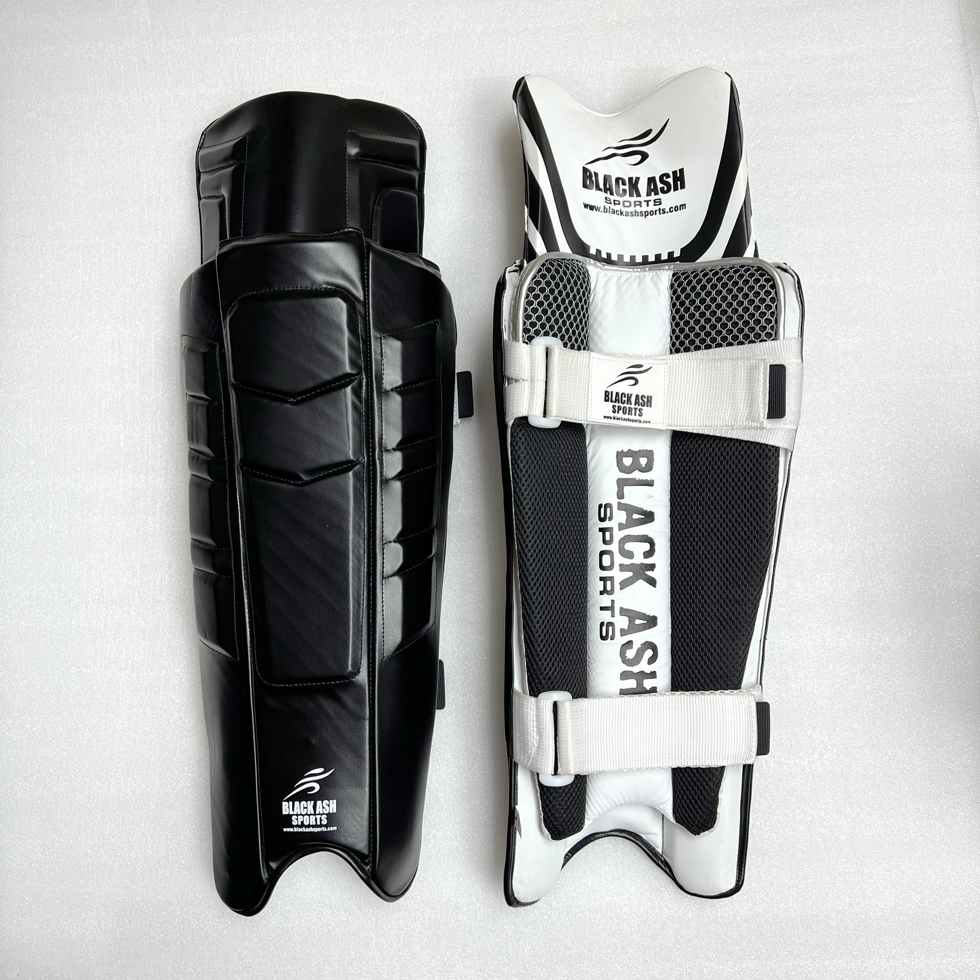 Black Ash Signature Batting Pads in Black, offering premium quality, lightweight and ultra-comfortable design with 3 Velcro straps, suitable for players seeking protection without sacrificing mobility, available in multiple colors.