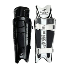 Load image into Gallery viewer, Black Ash Signature Batting Pads in Black, offering premium quality, lightweight and ultra-comfortable design with 3 Velcro straps, suitable for players seeking protection without sacrificing mobility, available in multiple colors.