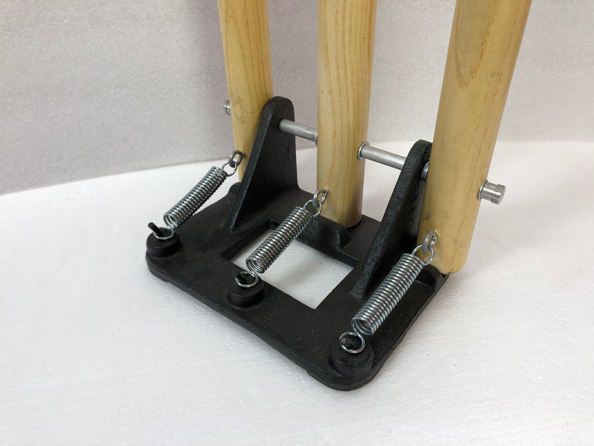 Set of Black Ash spring return stumps, featuring three stumps mounted on a spring-loaded base for convenience and portability, comes with bails in matching colors, made of Ash wood, available in black, blue, and natural wood colors.
