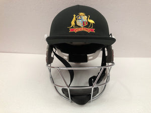 Black Ash custom International adjustable helmet, featuring a high impact polypropylene shell and chrome finish steel grill with 8 micro adjustments for enhanced protection and visibility, sweat-absorbent padding, and soft ear protection, adjustable to fit sizes 52-58 cm.