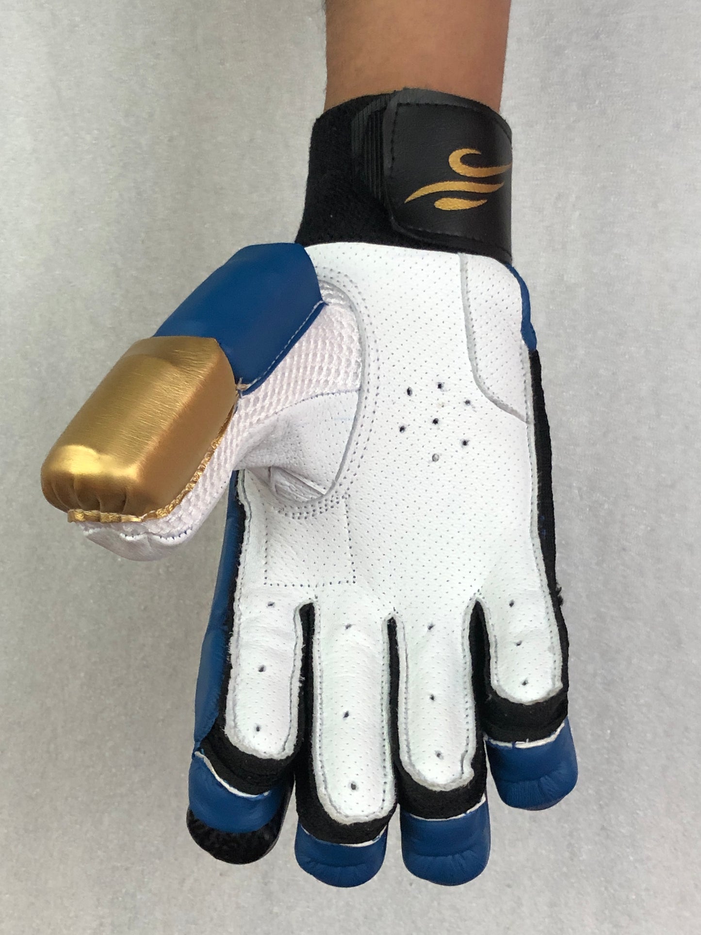 Blue/Gold Cricket Batting Gloves by Black Ash, offering light-weight high-density foam for protection, strong inserts for additional finger protection, full leather palm, and available for both right and left-hand players in blue and gold.