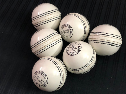 Pack of 6 white Black Ash PVC soft cricket training balls, each weighing 90 grams, designed for coaching and training, with a top-quality PVC construction and soft center, suitable for indoor and outdoor use.