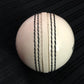 Pack of 6 white Black Ash PVC soft cricket training balls, each weighing 90 grams, designed for coaching and training, with a top-quality PVC construction and soft center, suitable for indoor and outdoor use.