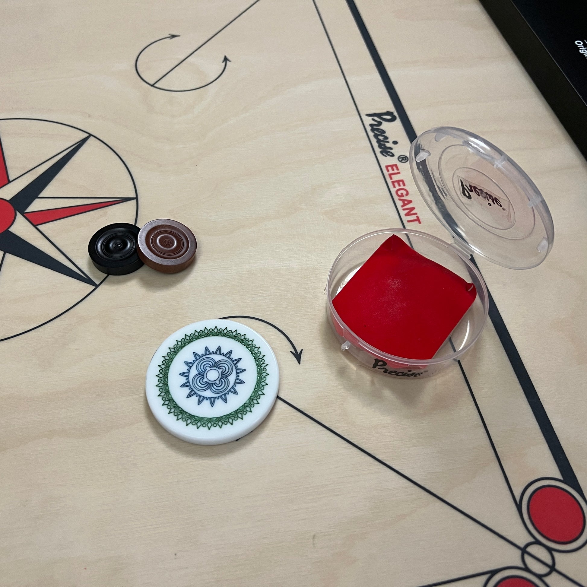 2.5 inch Precise carrom striker, weighing approximately 25 grams, designed for professional play, packed in a plastic box with a unique design, exclusively from Black Ash Sports.