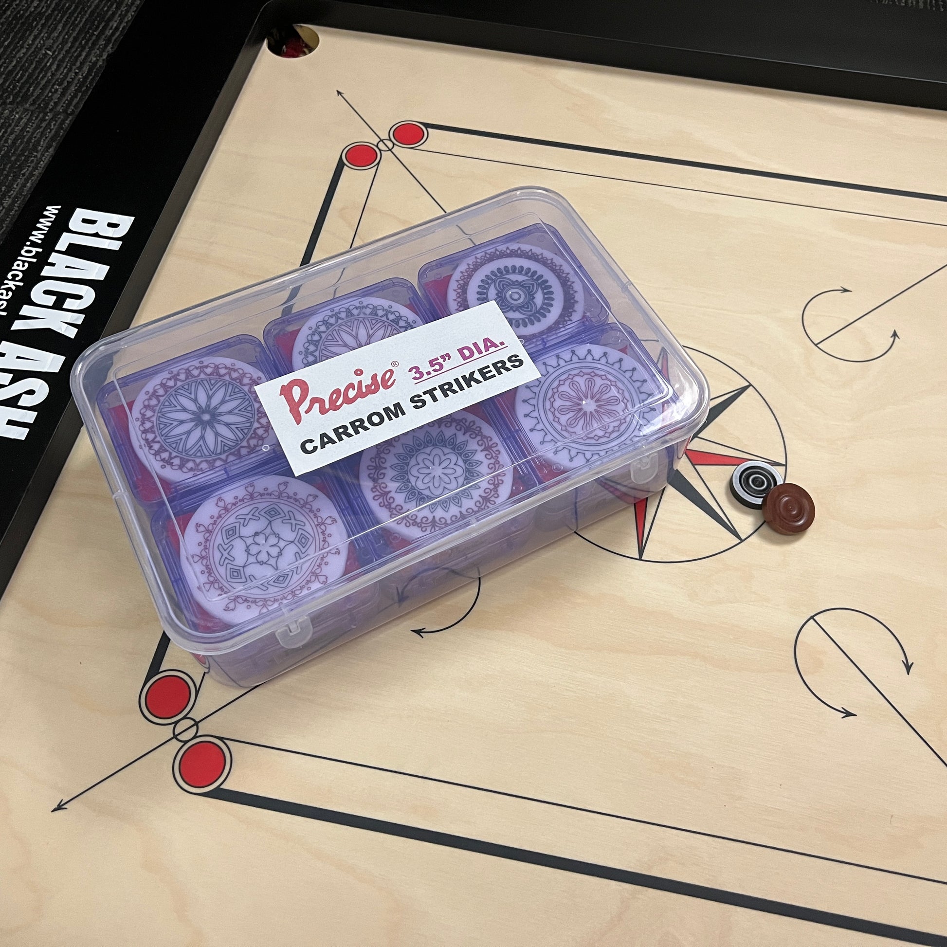 Professional grade 3.5 inch Precise carrom striker, weighing approximately 56 grams, packed in a plastic box with a unique elegant design, sold exclusively by Black Ash Sports.