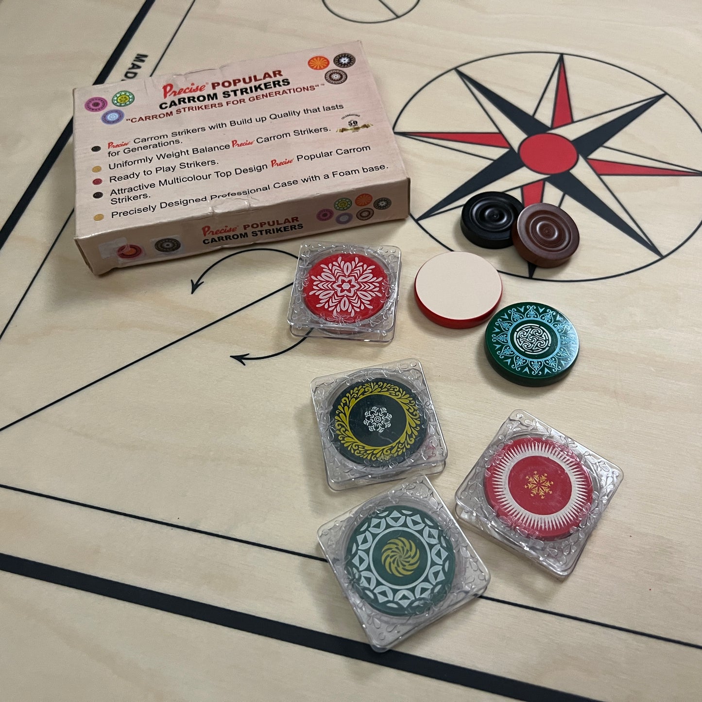 Home-use Precise Popular carrom striker, made of highly polished ceramic, weighs approximately 15 grams, each with a unique design, sold exclusively by Black Ash Sports.