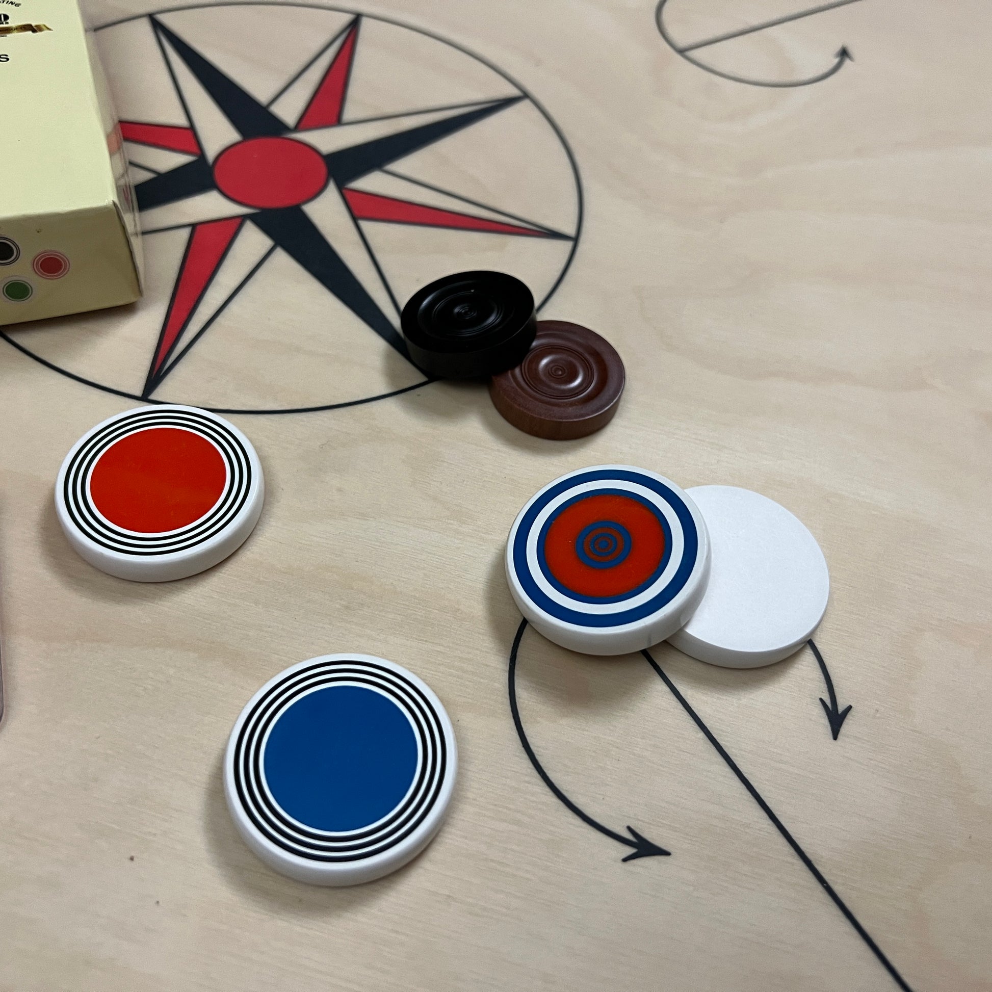 Regular class Precise Chroma carrom striker, packed in a professional box, each with a unique elegant design, available only at Black Ash Sports.