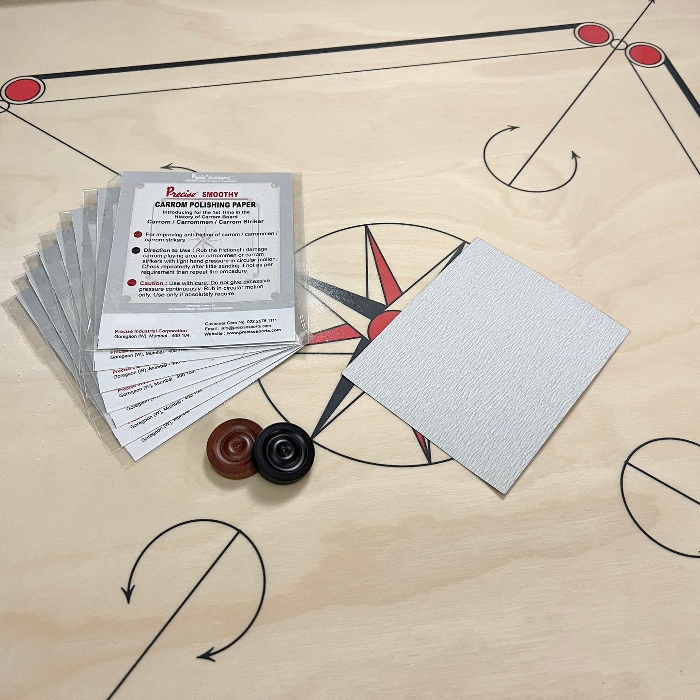 Pack of Precise Smoothy carrom polishing paper by Black Ash Sports, designed to improve the anti-friction qualities of carrom boards, carrommen, and carrom strikers for smoother play.