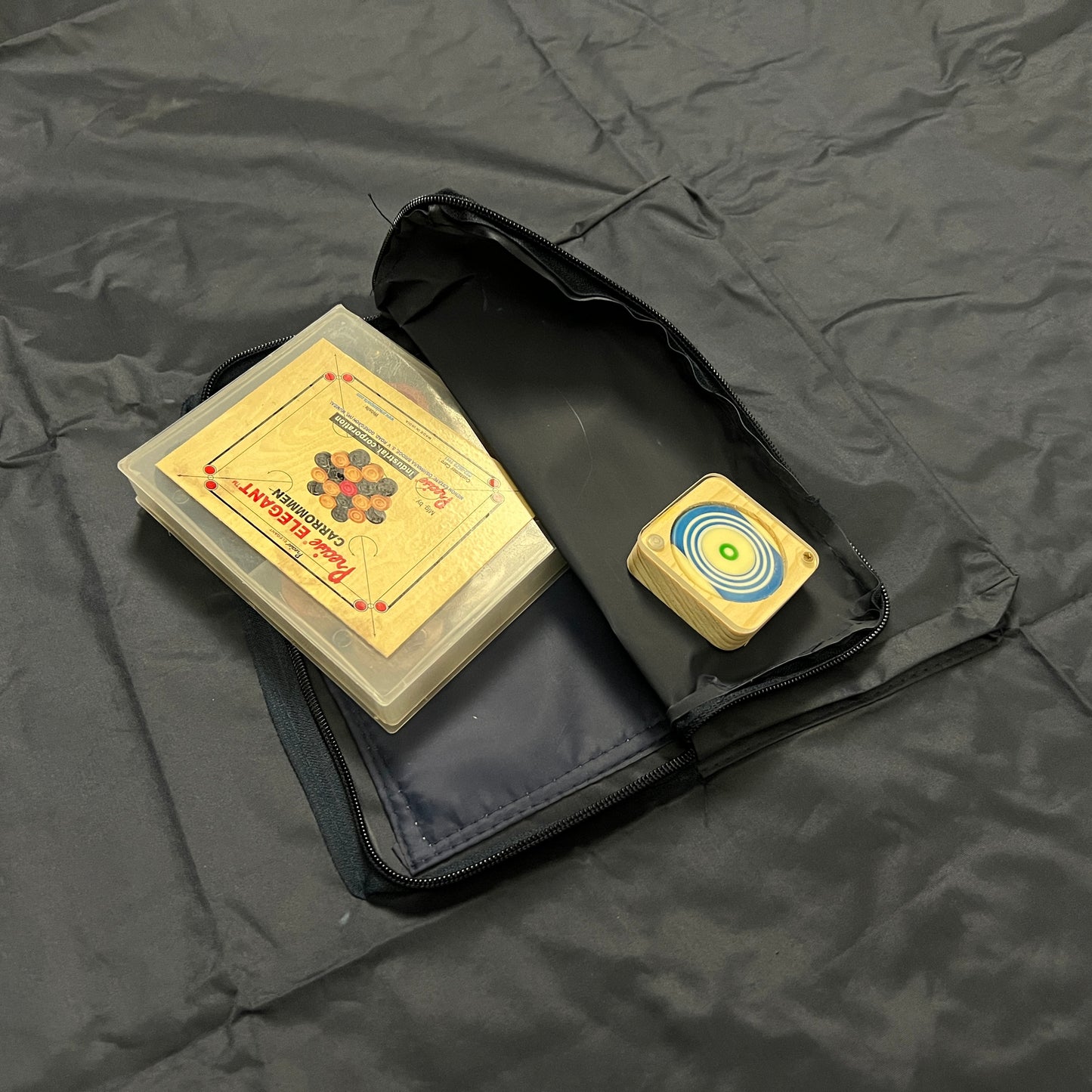 Heavy quality rexine protective cover for 32x32 inch carrom boards, featuring a pocket for storing accessories, ensuring the playing surface is protected when not in use.